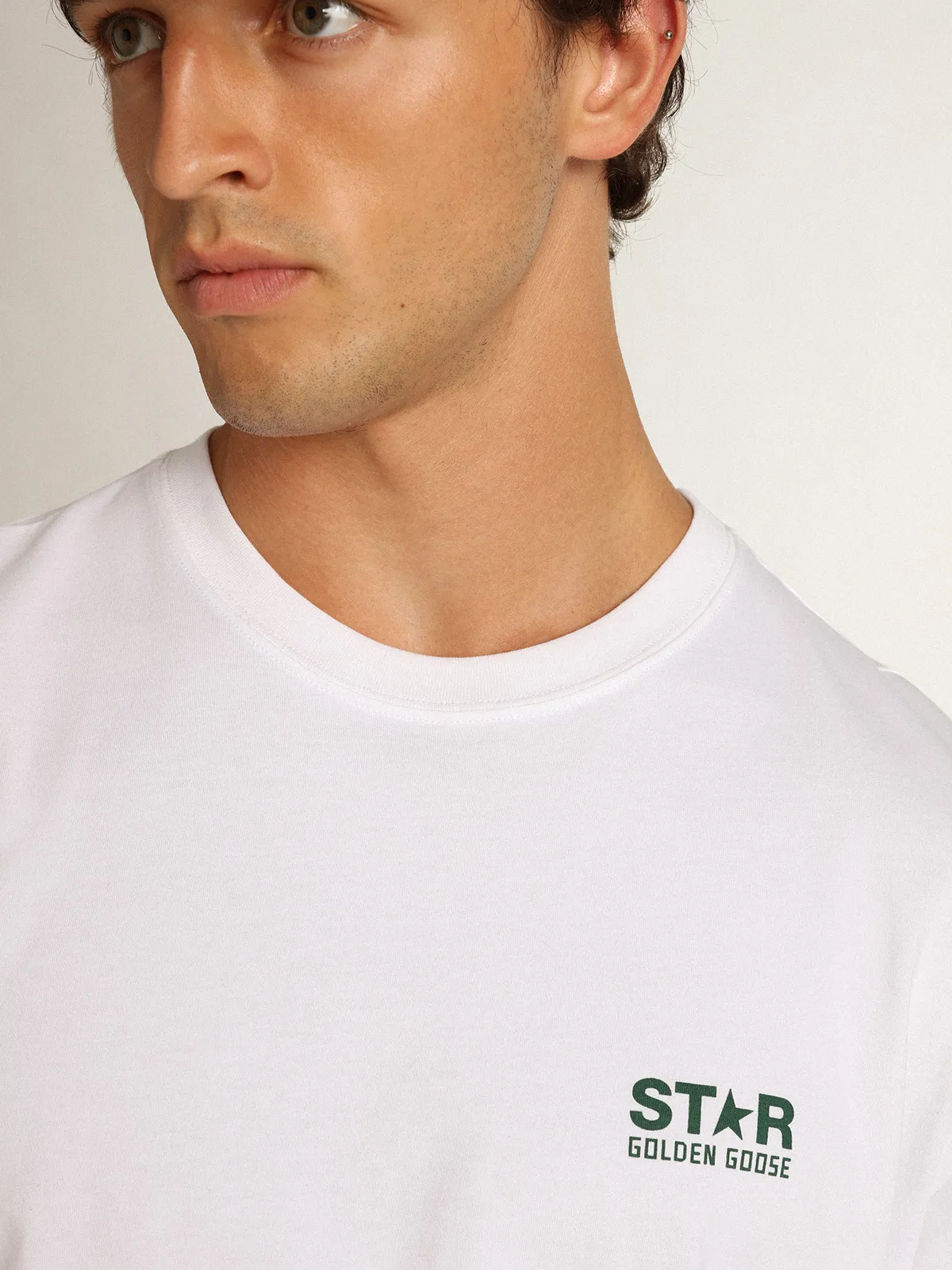 Men's white T-shirt with contrasting green logo and star